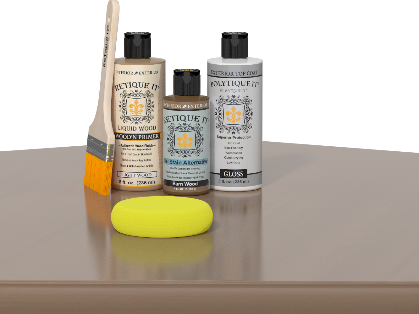 Retique It Barn Wood Kit with Light Wood Wood'n Primer, Barn Wood Gel Stain Alternative, Gloss Polytique It topcoat, paintbrush, and yellow sponge on a tabletop.