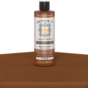 Retique It Liquid Wood Wood'n Stain in Cedar color, 8 oz bottle showing the stain's warm cedar wood finish.