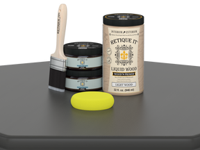 Retique It® Multi-purpose Smooth Finish Kit (Large) in Charcoal for wood finishing, shown in a table setting.