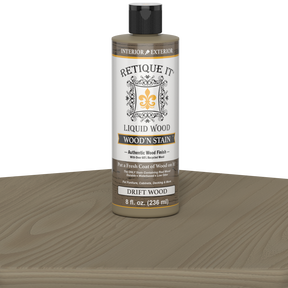 Retique It Liquid Wood Wood'n Stain in Drift Wood, 8 oz bottle, showcasing the natural wood stain and color for furniture or crafts.