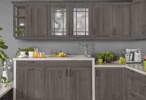 Large Harbor Gray Wood'n Finish Kit for exterior wood surfaces, showing textured wood grain on kitchen cabinets.