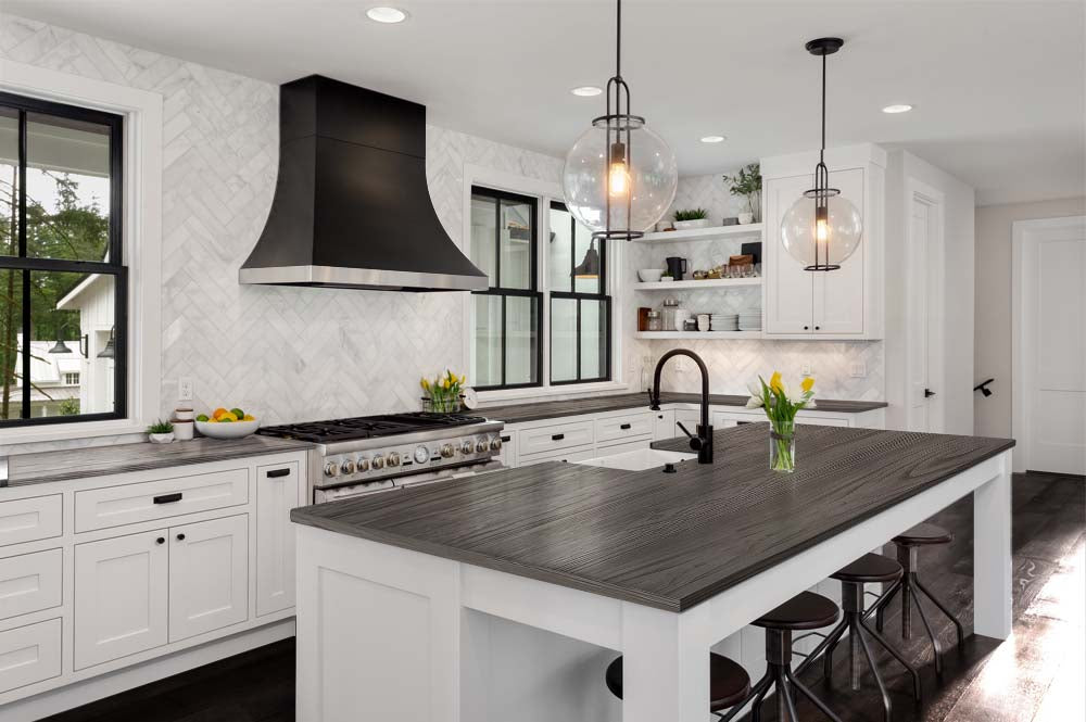 Retique It Wood'n Kit in Harbor Gray for interior wood surfaces, showing a kitchen countertop with a textured, grained finish.