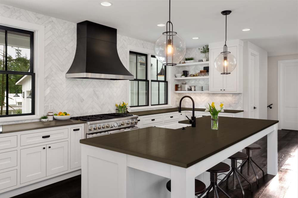 Retique It® Multi-purpose Smooth Finish Kit (Large) in Charcoal for interior wood surfaces, displayed on a kitchen countertop.
