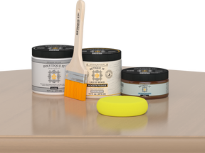 Retique It® White Oak Multipurpose Kit contents with Liquid Wood primer, Pecan gel stain alternative, gloss exterior top coat, paintbrush, and yellow sponge displayed on a light wood surface.