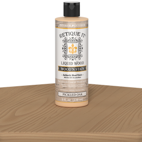Retique It Liquid Wood Wood'n Stain in Pickled Oak, 8 oz jar, showcasing the stain's light oak color and smooth application.