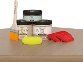 Retique It® Wood'n Kit in Pickled Oak, a multi-purpose wood finish kit, showing wood stain and finishing tools on a table.