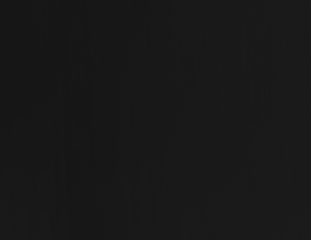 Ebony finish swatch showing subtle vertical wood-grain texture.