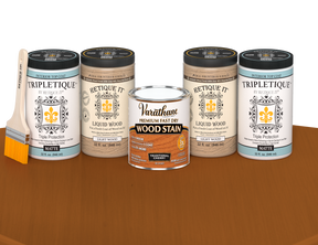 64 oz Retique It Liquid Wood kit with Traditional Cherry stain, matte Tripletique topcoat, and a paintbrush on a matching finished tabletop.