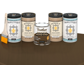 64 oz Retique It Liquid Wood kit with Briarsmoke stain, satin Tripletique topcoat, and a paintbrush on a matching finished tabletop.