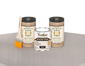 64 oz Retique It Liquid Wood kit with Varathane Antique White stain and a paintbrush on a matching finished tabletop.