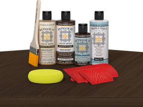 Retique It® Wood'n Finish Kit in Black Walnut stain, showing a tabletop with a smooth, finished wood surface and stain application.