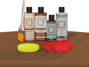 Multi-purpose Cedar Wood'n Finish Kit by Retique It® with exterior top coat on a table, showing kit components and cedar wood samples.
