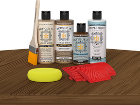 Retique It® Wood'n Kit Modern Walnut interior topcoat set displayed on table, showcasing wood finish application and kit components.