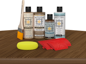 Retique It® Barn Wood Wood'n Kit with Light Wood Primer, Barn Wood Wood'n Stain, Gloss TripleTique Top Coat, Pecan Gel Stain Alternative, yellow sponge, red graining tool, and brush.