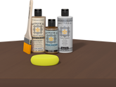 Retique It refinishing kit with Light Wood primer, Dark Oak gel stain alternative, matte Polytique It topcoat, a brush and yellow sponge.