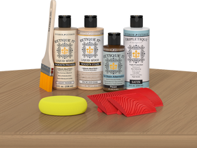 Retique It® Wood'n Finish Kit in Pickled Oak stain, featuring a wooden tabletop with the stain applied for a natural finish.