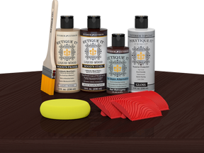 Red Mahogany Wood'n Finish Kit by Retique It® with exterior top coat and tools, displayed on a table for multi-purpose wood finishing.