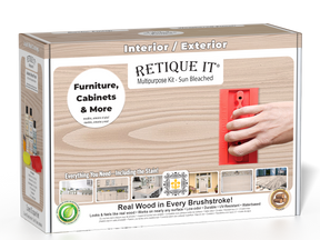 Sun-bleached Retique It Wood'n Finish Kit in an open box with brushes and wood samples, designed for multi-purpose wood finishing.