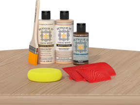 Multi-purpose Wood'n Kit in White Oak by Retique It® displayed on a table, featuring wood finish tools and supplies.