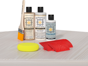 Retique It® Wood'n Finish Kit in White Wash, a multi-purpose wood finish kit with brushes and applicators on a table.
