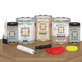 Retique It® Wood'n Cabinet Kit with 48 pickled oak stained doors and gloss finish, showcasing grained wood texture on a table.