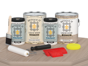 Sun-bleached Wood'n Finish Kit by Retique It® with four large wood finishing products on a table.