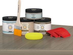 Retique It Wood'n Finish Kit in Drift Wood stain displayed on a table, showcasing a double-size stain kit for wood finishing projects.