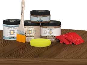 Retique It® Wood'n Kit in Modern Walnut for interior topcoat, shown on table with wood finish supplies and tools.