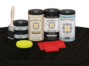 Retique It Wood'n Finish Kit with four large black stain bottles and matte finish on a table surface.
