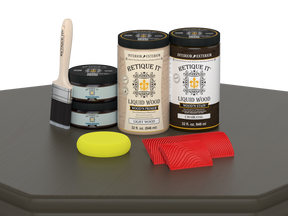 Large Charcoal Wood'n Finish Kit by Retique It® for multi-purpose wood finishing, includes brushes and tools on a table.