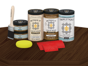 Retique It® Wood'n Finish Kit in Dark Oak stain with four large bottles, matte wood finish on a tabletop.