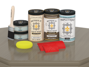 Large Wood'n Kit by Retique It® with driftwood finish, including interior top coat, featuring a glossy wood surface and finishing tools.