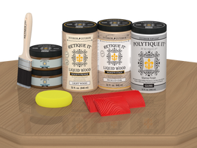 Retique It® Wood'n Finish Front Door Kit in Pickled Oak stain, featuring a double door with glossy finish, displayed on a table.