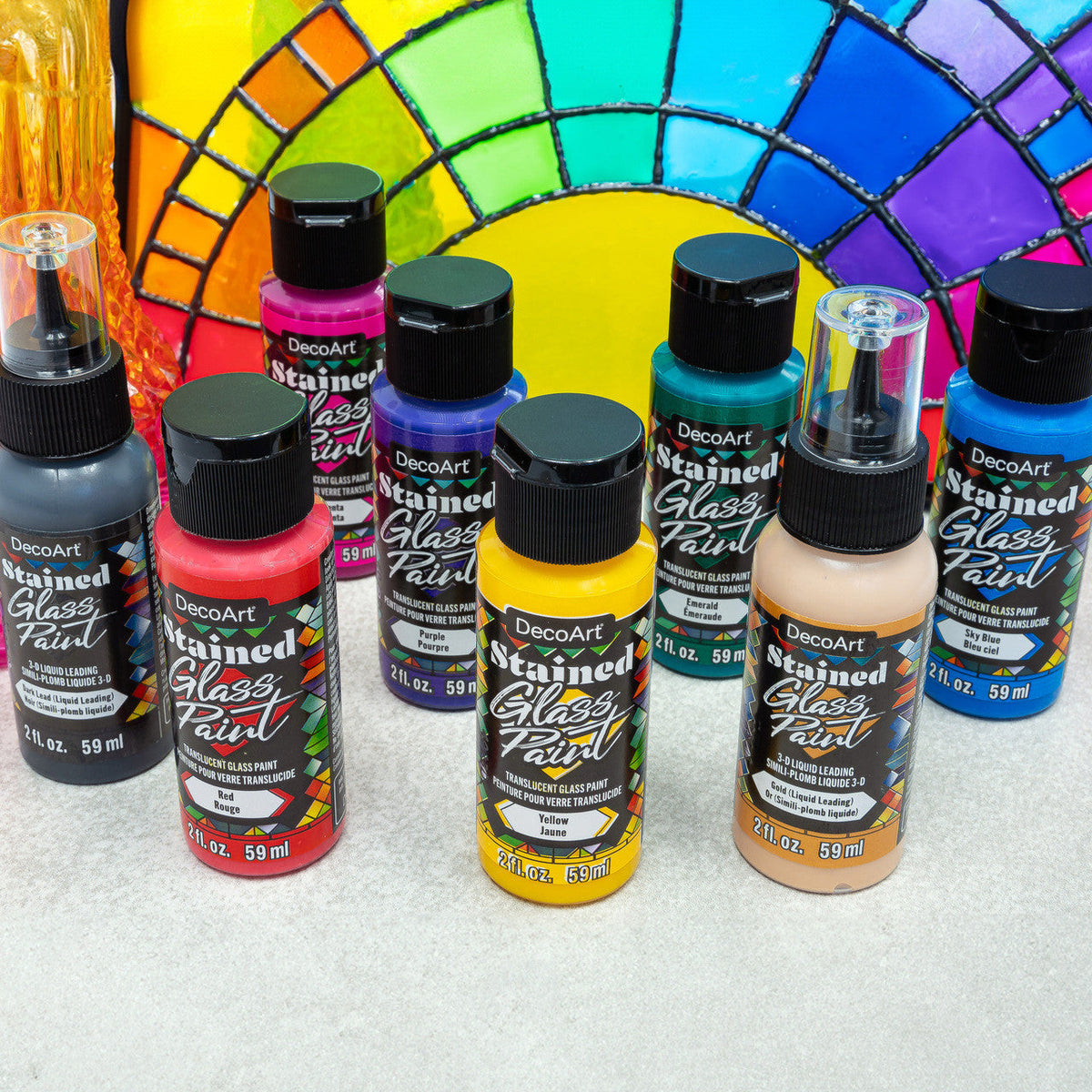 Rainbow Stained Glass Paint Set by DecoArt featuring vibrant, colorful paints for creating stained glass effects on glass surfaces.