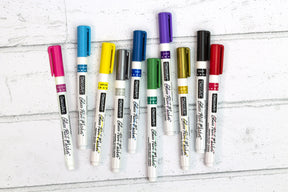 DecoArt silver opaque glass paint markers with fine tips for decorating and lettering on glass surfaces.