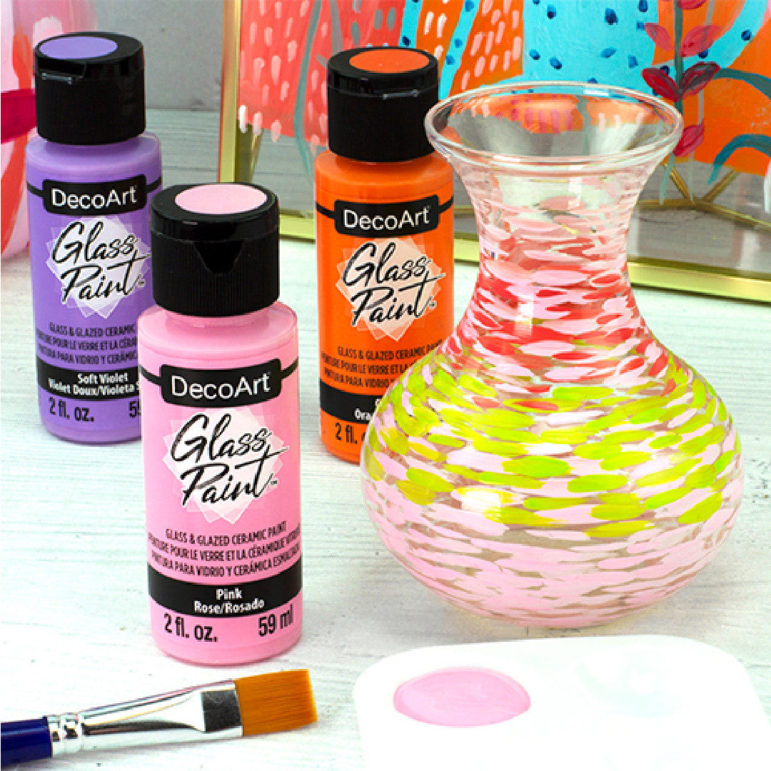 White DecoArt Glass Paint in a 2 oz bottle, suitable for decorating and customizing glass surfaces.