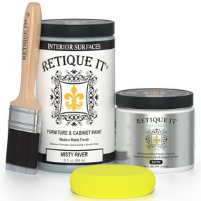 Retique It® furniture and cabinet paint in Misty River quart, showing a smooth, painted furniture surface with a rich blue-gray finish.