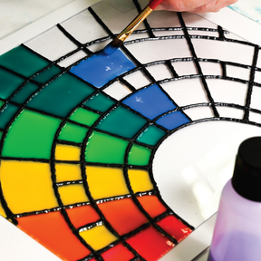 DecoArt stained glass paint complete set with six vibrant colors and applicators for creating colorful stained glass art.